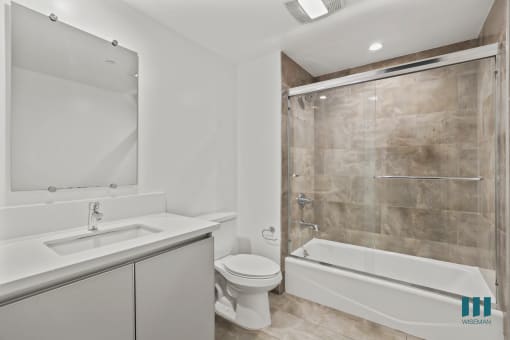Bathroom with Shower Bath with Glass Door and Vanity Cabinet Storage