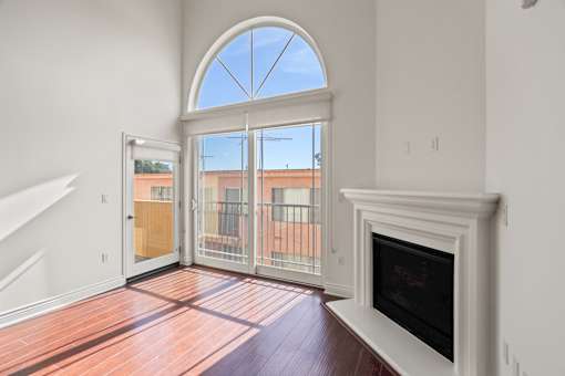 Living Room with Electric Fireplace and Patio