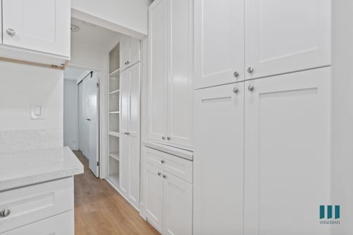 Ample Kitchen and Hallway Cabinet Storage