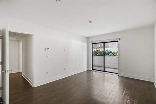 Spacious Bedroom with Vinyl Flooring and Patio