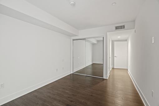 Bedroom with Mirrored Closet