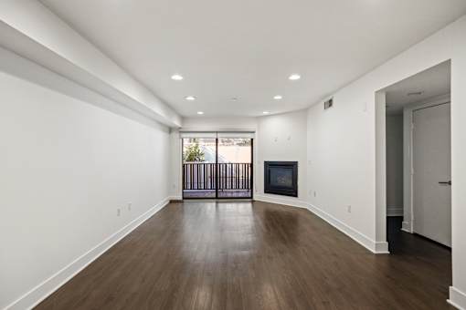 Living Room with Electric Fireplace, Recessed Lighting, Vinyl Flooring, and Patio