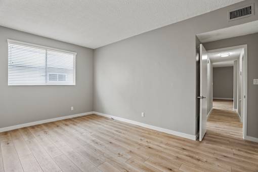 Bedroom with Window and Vinyl Flooring