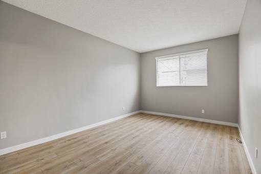 Large-Size Bedroom with Vinyl Flooring and Windows