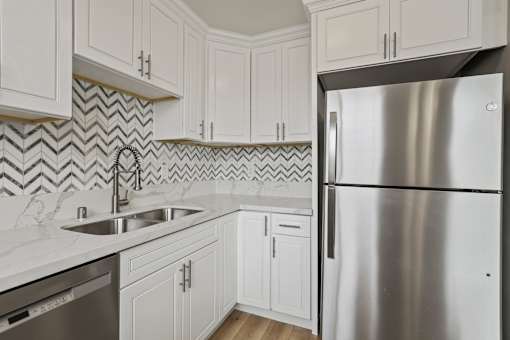 Kitchen with Double-Sinks, Refrigerator, and Dishwasher