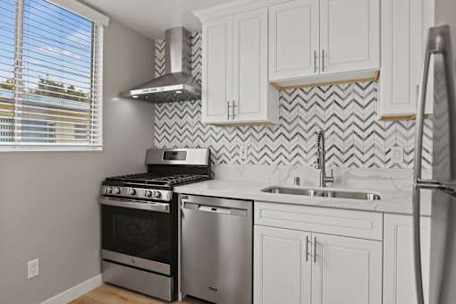 Kitchen with Stainless-Steel Refrigerator, Stove, and Dishwasher