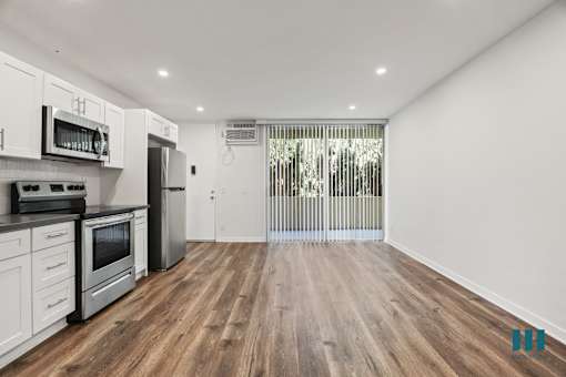 Open-Concept Kitchen, Dining, and Living Room Areas with Large-Size Windows