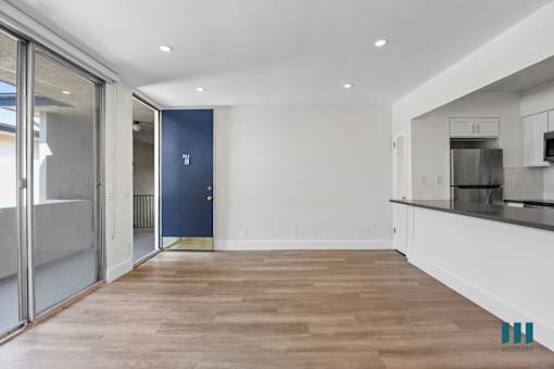 Front Entrance and Open-Concept Kitchen, Dining, and Living Room Areas