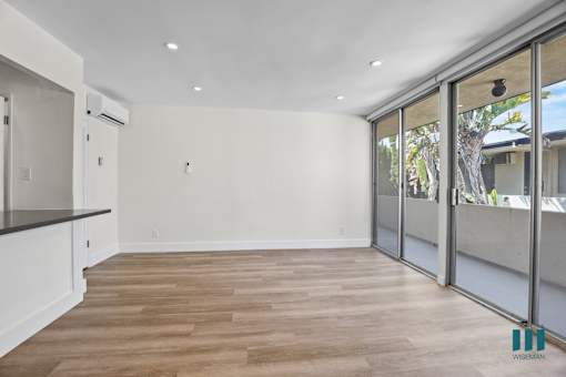 Living Room with Sliding Glass Doors Leading to Balcony