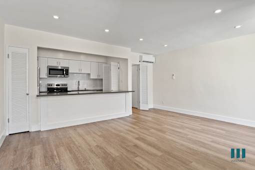 Open-Concept Kitchen, Dining, and Living Room Areas