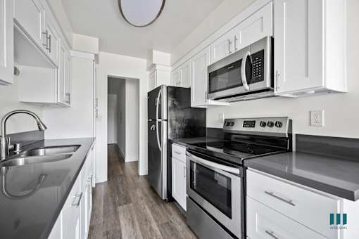 Kitchen with Refrigerator, Stove, Microwave Oven, and Dishwasher