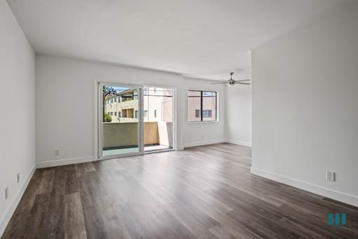 Open-Concept Dining and Living Room with Patio