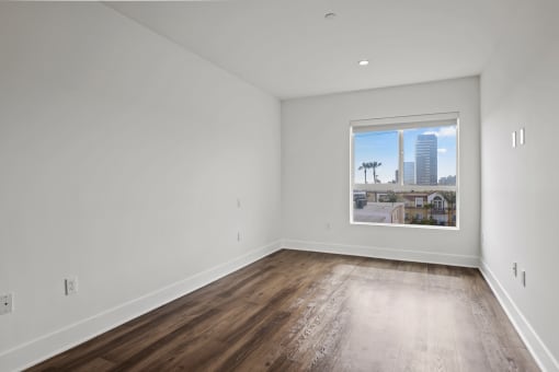 Bedroom with Large Windows and Vinyl Flooring