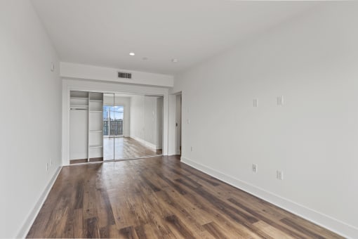 Bedroom with Large-Size Mirrored Closet with Shelving