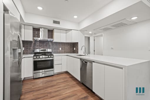 Open-Concept Kitchen with Energy-Efficient Appliances and Countertop Bar