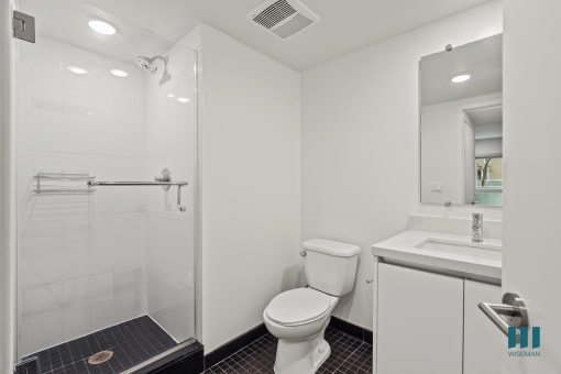 Bathroom with Stand-Up Shower with Glass Door and Vanity Cabinet Storage