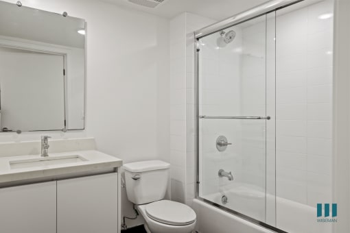 Bathroom with Shower Bath with Glass Door and Vanity Cabinet Storage