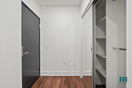 Front Entrance with Hall Closet with Built-In Shelving