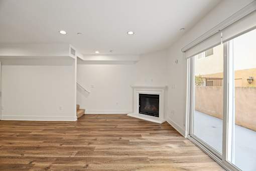 Living Room with Electric Fireplace and Spacious Patio