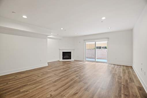 Open-Concept Dining and Living Room with an Electric Fireplace