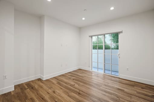 Living Room with Recessed Lighting, Vinyl Flooring, and Patio