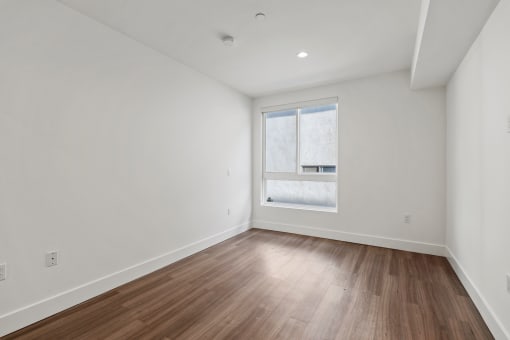 Bedroom with Vinyl Flooring and Windows