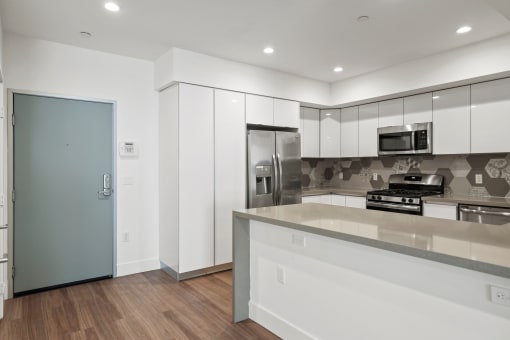 Front Entry of Apartment and Kitchen