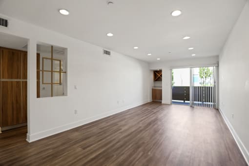 Open-Concept Dining and Living Room Space with Patio