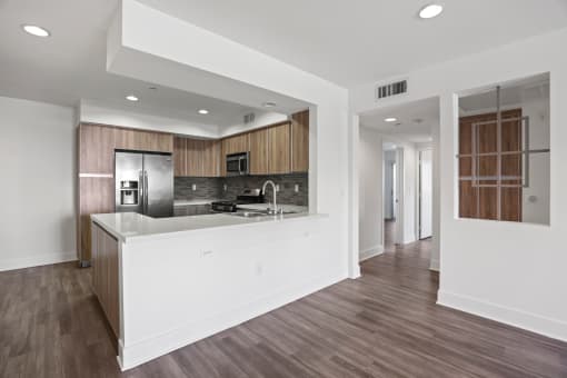 Kitchen with Countertop Bar and Dining Area