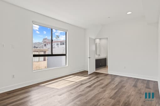 Spacious Bedroom with Bathroom and Windows