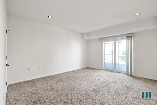 Bedroom with Closet, Carpet, Recessed Lighting, and Balcony