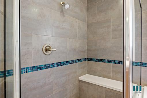 Walk-In Shower with Glass Shower Door and Interior Bench