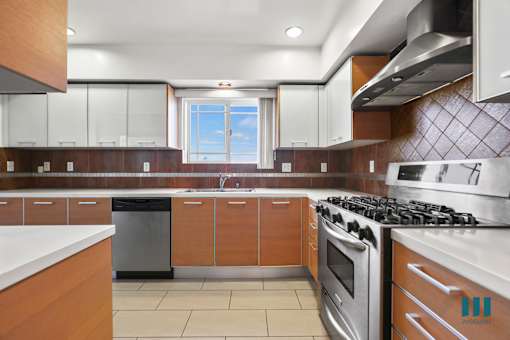 Kitchen with Stainless Steel Appliances and Ample Cabinet Storage