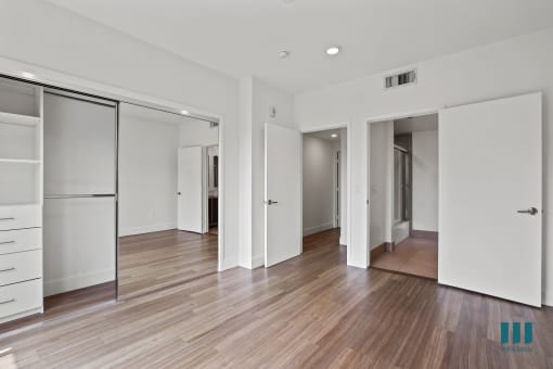 Bedroom with Large-Size Mirrored Closet with Built-In Shelving
