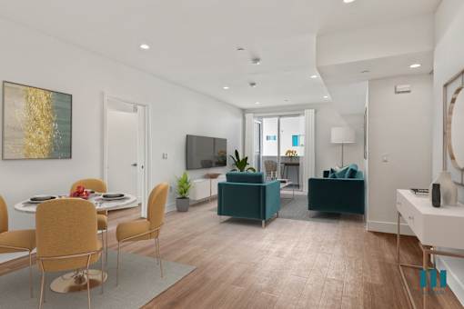 Open-Concept Dining, Living Room, and Patio with Recessed Lighting and Vinyl Flooring
