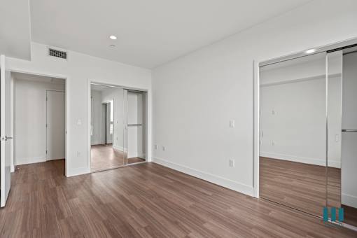 Bedroom with Two Mirrored Closets