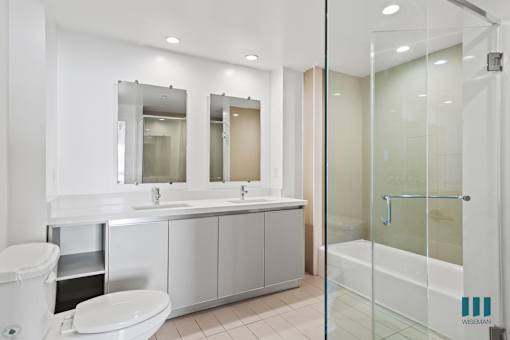 Bathroom with Walk-In Shower, Bathtub, and Double-Sink Vanity with Cabinet Storage