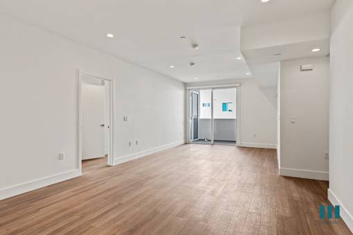 Open-Concept Dining and Living Room with Vinyl Flooring, Recessed Lighting, and Patio