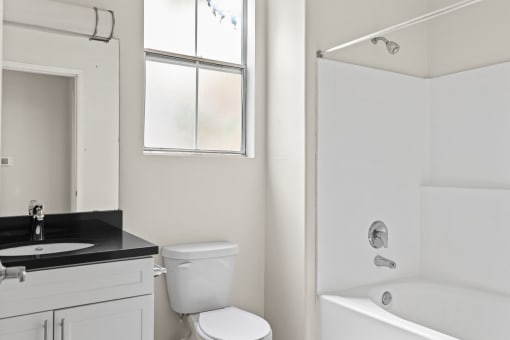 Bathroom with Bathtub and Cabinet Storage