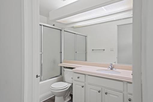 Bathroom with Bathtub and Vanity with Cabinet Storage
