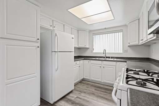 Kitchen with Appliances and Ample Cabinet Storage