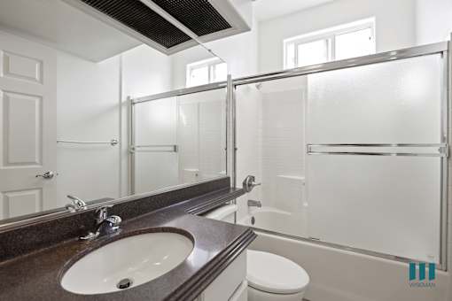 Bathroom with Shower Bath with Glass Door and Vanity Cabinet Storage