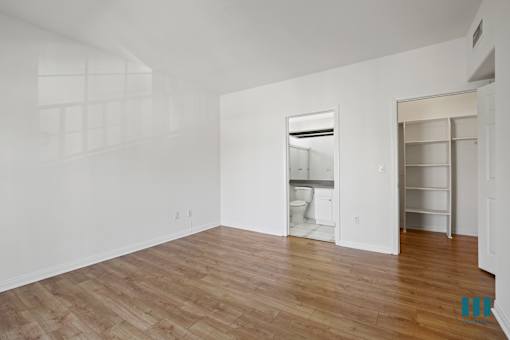 Bedroom with Bathroom and Walk-In Closet