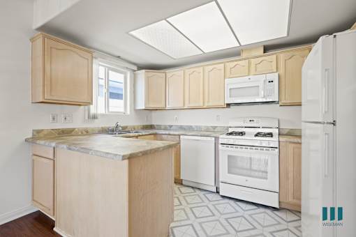 Kitchen with Refrigerator, Stove, Dishwasher, and Microwave Oven
