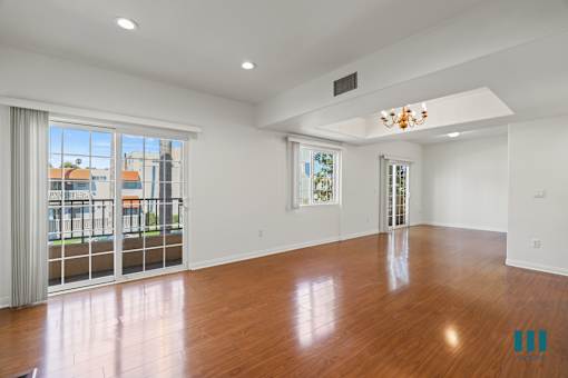 Open-Concept Dining and Living Room with Recessed Lighting, Vinyl Flooring, and Balcony