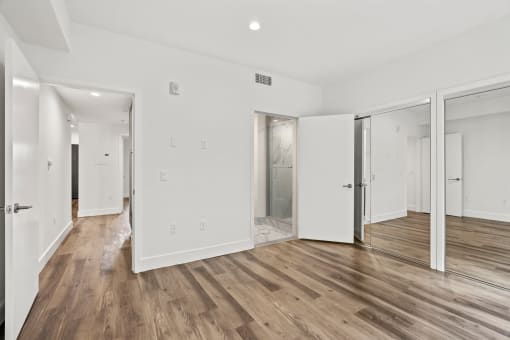Bedroom with Bathroom and Double Mirrored Closets