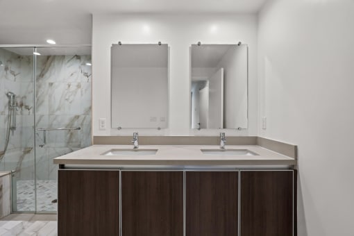 Bathroom with Double-Sink Vanity and Walk-In Shower with Glass Door