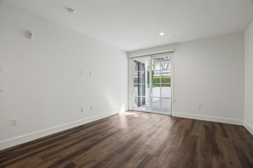 Spacious Bedroom with Patio, Vinyl Flooring, and Recessed Lighting