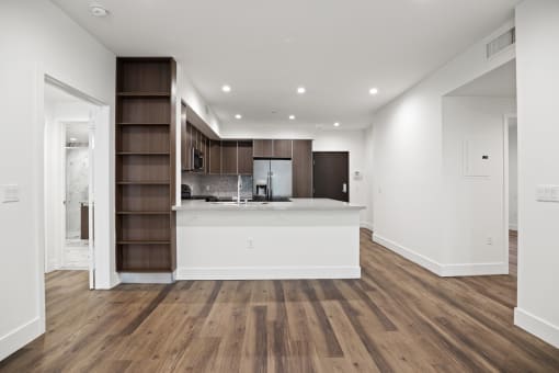 Kitchen and Dining Space with Countertop Bar and Built-In Shelving
