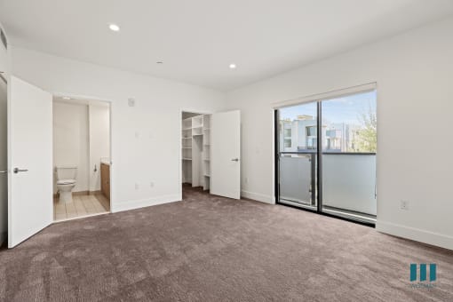 Bedroom with Bathroom, Walk-In Closet, Recessed Lighting, and Balcony